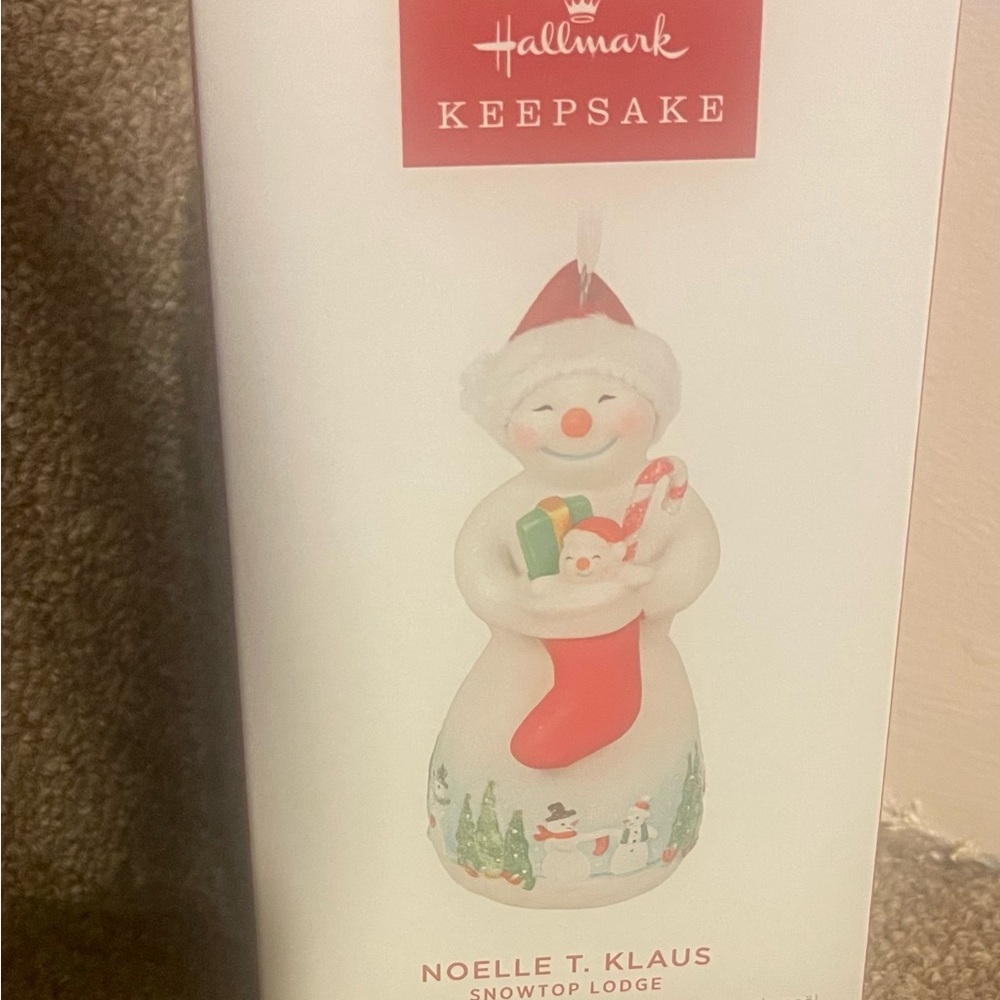 Hallmark NOELLE T. KLAUS Snowtop Lodge ornament.